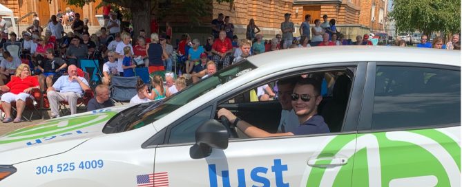 All Smiles inside the JustTech Car at Portsmith River Days